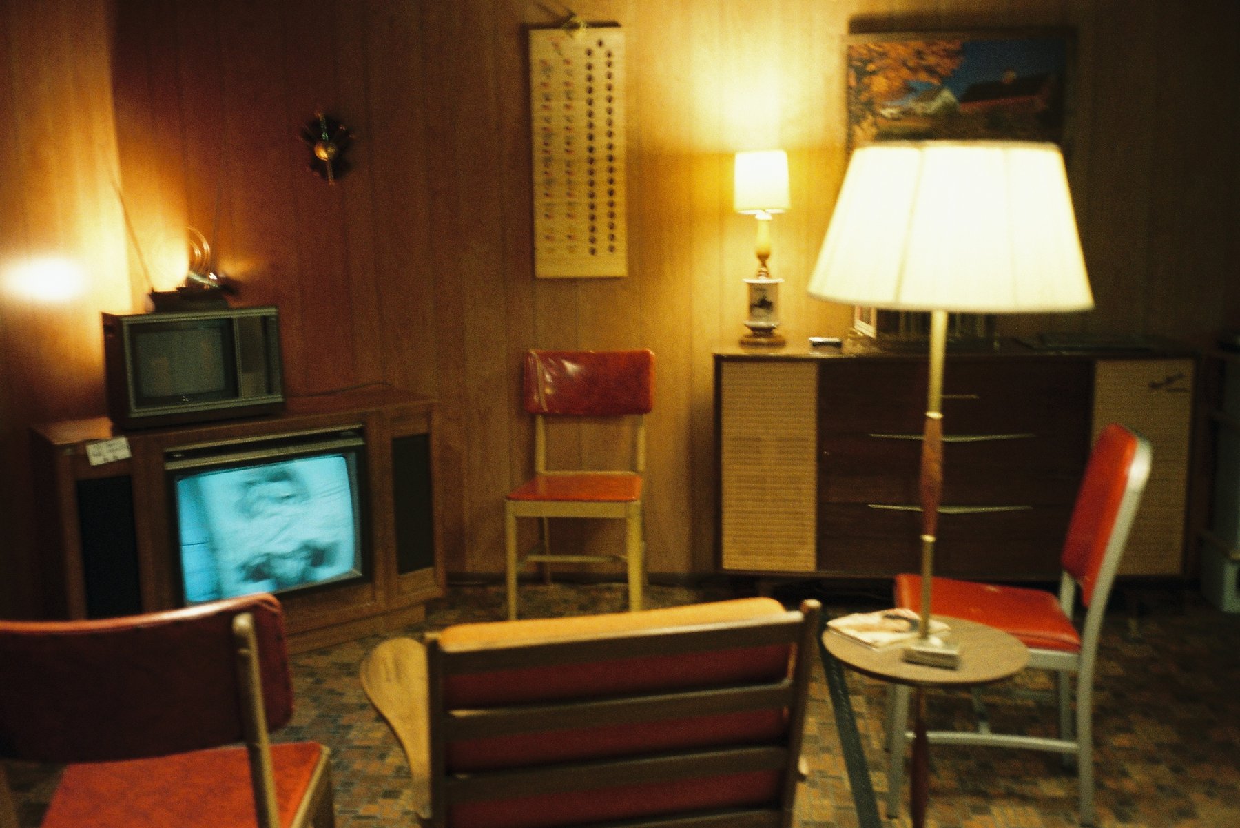 Retro 1970s living room with glowing lamps and a vintage television